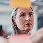 Sticky Note Glass And Business Woman Thinking Of Ideas Strategy Or