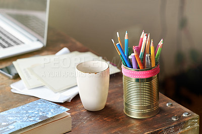 Buy stock photo A desk with pencils, a cup and greeting cards