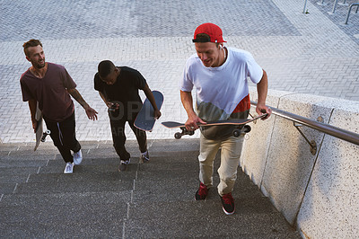 Buy stock photo Shot of a group of skaters walking together