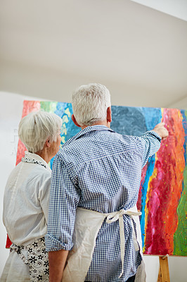 Buy stock photo Shot of a senior couple painting at home