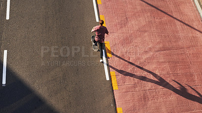 Buy stock photo Shot of a young man skating in the city