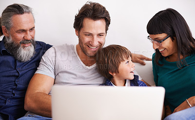 Buy stock photo Family, laptop and young boy or streaming on couch, smile and bonding in living room. Video call, technology and happy grandfather with parents on sofa, computer and communication online in lounge