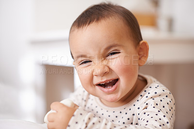 Buy stock photo Baby, toddler portrait and laugh in home, childhood and smile for enjoyment or fun in bedroom. Girl, kid and happy for child development and relax by bed, satisfaction and face for humor or silly