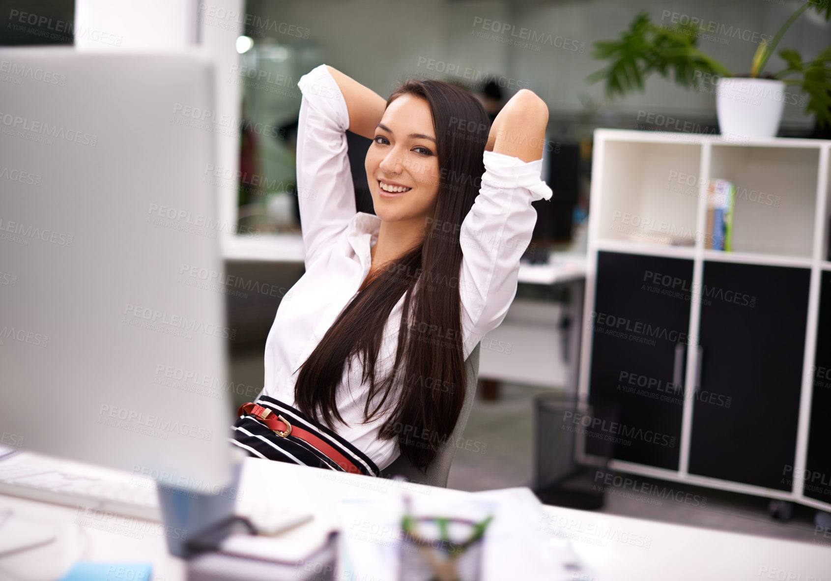 Buy stock photo Portrait of an attractive young businesswoman working at her desk