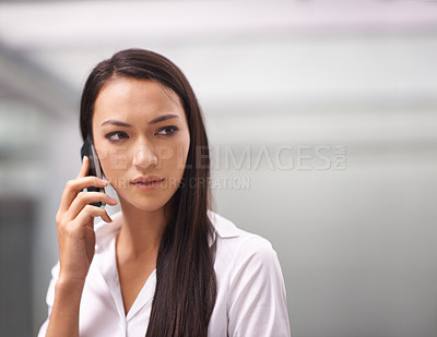 Buy stock photo Face, phone call and serious with business woman in corporate office for communication or networking. Concern, problem solving and thinking with worried young employee talking on mobile in workplace