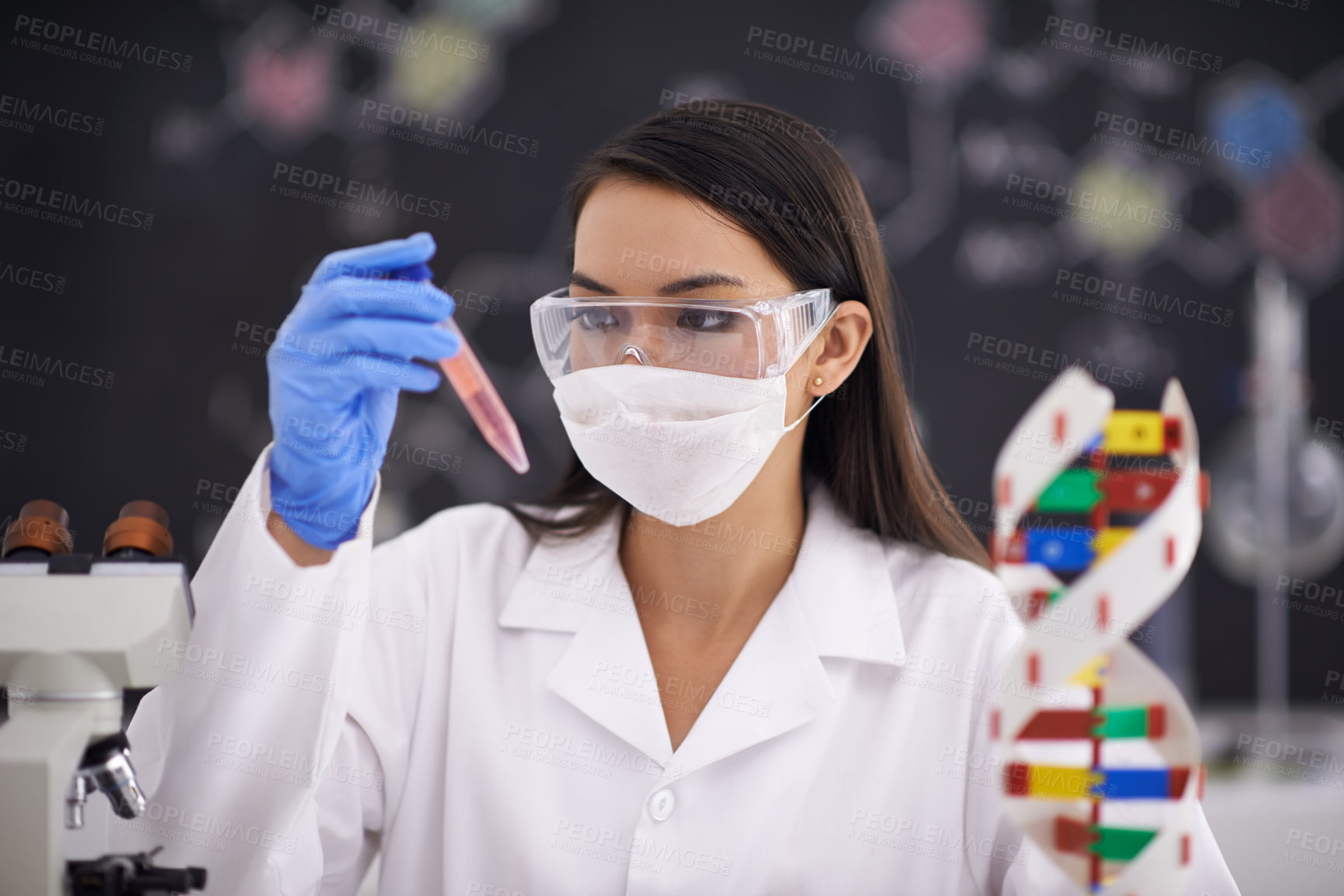 Buy stock photo Science, test tube and woman in mask for medical research, experiment and dna. Scientist, glasses and professional with vial for chemistry, biology and check liquid sample for laboratory analysis