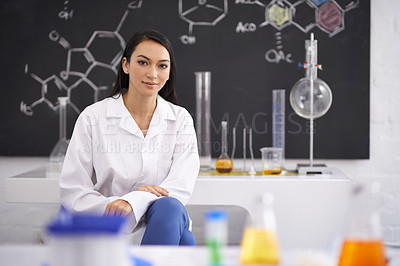 Buy stock photo Portrait of a female scientist sitting in a laboratory
