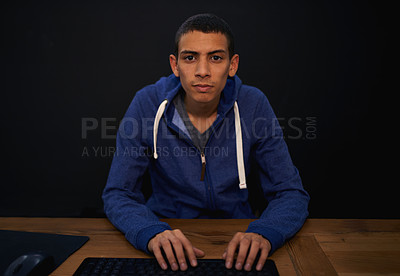 Buy stock photo Student, portrait and man typing on desk, working on assignment for university. Studying, programming and educational development in home, elearning on technology and pov for focused male person