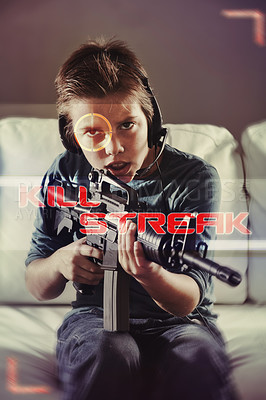 Buy stock photo An image of a young boy playing violent video games