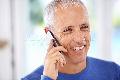 Buy stock photo Senior, man and face with phone call in home with laughing for funny conversation, discussion and mobile chat. Elderly, person and happy with smartphone for talking, comic joke and mockup space