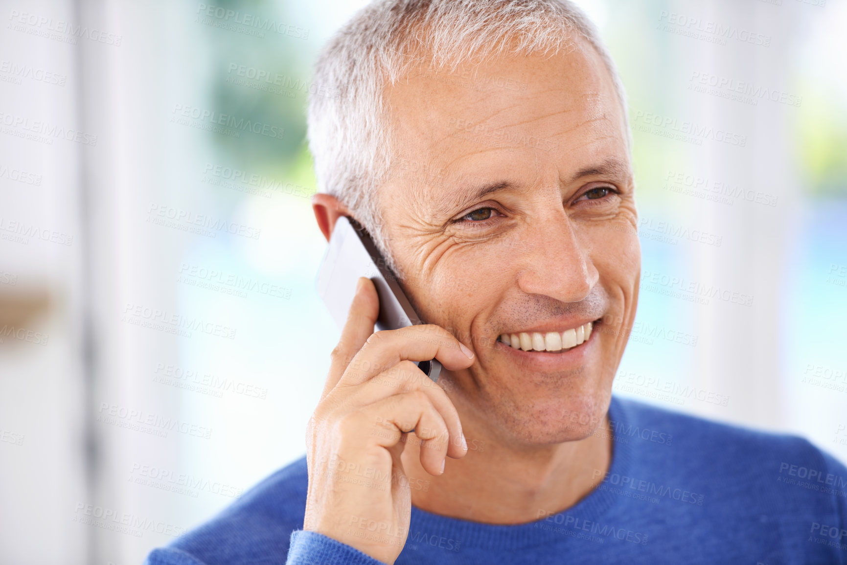 Buy stock photo Senior, man and face with phone call in home with laughing for funny conversation, discussion and mobile chat. Elderly, person and happy with smartphone for talking, comic joke and mockup space