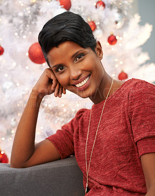 Buy stock photo Happy, christmas and portrait of woman at her home for festive event, party or celebration. Smile, holidays and face of female person from Colombia with xmas tree on sofa in living room at apartment.