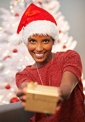 Buy stock photo Happy, santa hat and portrait of woman with present at her home for christmas event, party or celebration. Smile, holidays and face of female person with festive xmas tree and gift on sofa at house.