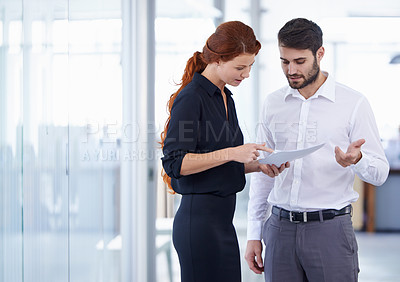 Buy stock photo Business people, documents and planning for corporate finance in meeting or teamwork at the office. Businessman and woman discussing paperwork in collaboration, financial management or company budget