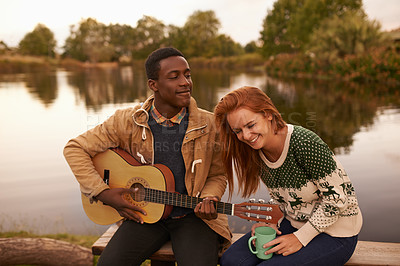 Buy stock photo Camping, guitar and couple by lake in nature on outdoor holiday, vacation and adventure, Campsite, travel and man and woman bonding with musical instrument in woods, forest and countryside together