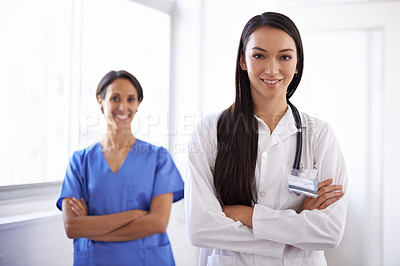 Buy stock photo Portrait, leader and medical team with confidence, smile and women in hospital for healthcare. Face, doctor or nurse with arms crossed in collaboration for wellness, cooperation or coworking together