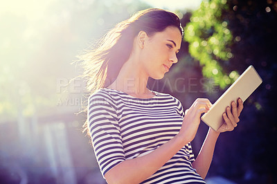 Buy stock photo Woman, tablet or social media for networking in nature, outdoor or search of travel app for tourist. Young person, touchscreen or scroll online for connectivity or reading message or email for update