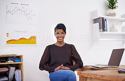 Buy stock photo A portrait of a beautiful young woman sitting happily in her office