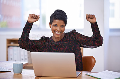 Buy stock photo A portrait of a beautiful young woman sitting in her office and raising her arms enthusiastically