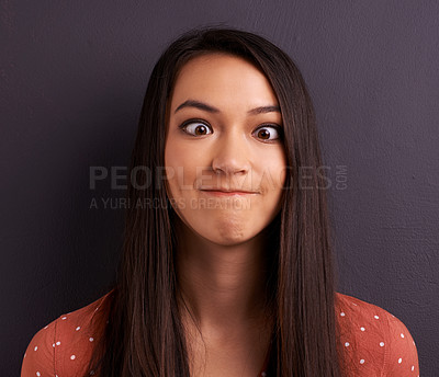 Buy stock photo Woman, funny face and studio for comedy expression as mockup space, grey background or humor. Female person, model and crazy emoji as meme for comic reaction with goofy good mood, carefree or squint