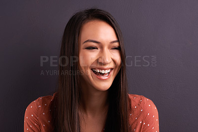 Buy stock photo Woman, laughing and comedy humor in studio with carefree happiness, grey background or mockup space. Female person, good mood and funny joke smile or relaxed emoji expression, positivity or cheerful