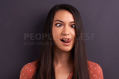 Buy stock photo Woman, funny face and studio for comedy tongue out or mockup space, grey background or humor. Female person, model and crazy emoji as meme for comic reaction with goofy good mood, carefree or squint