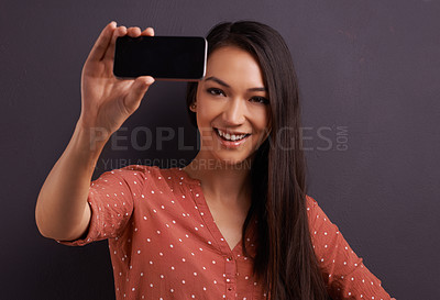 Buy stock photo Woman, selfie and social media for online connection on studio for profile picture, technology or grey background. Female person, smiling and internet communication for update post, vlog or mockup