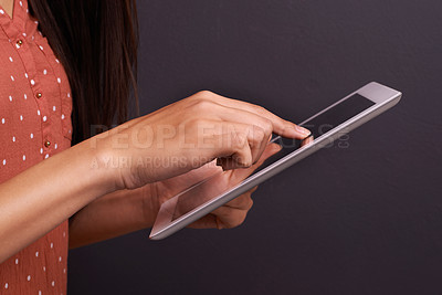 Buy stock photo Hand, tablet and communication with internet connection in studio black background, conversation or streaming. Person, fingers and digital touchscreen for contact us technology, online or mockup