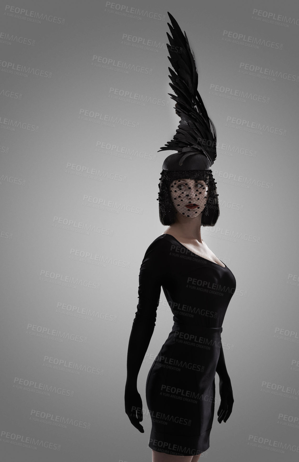 Buy stock photo Woman, feather and art for fashion in studio for fantasy or magic with unique creativity for art or illusion. Female person, isolated and white background for designer clothes, diva and surreal