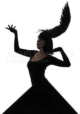 Buy stock photo Shot of a young woman wearing a wing-shaped, feathered headpiece with a black triangle graphic