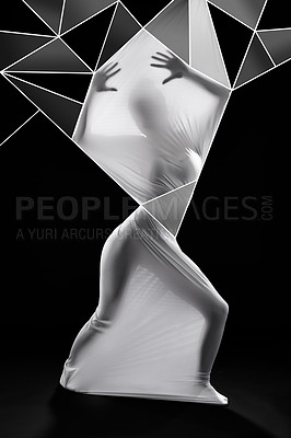 Buy stock photo Studio shot of a woman wrapped in fabric and surrounded by geometric shapes against a black background