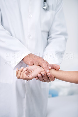 Buy stock photo Cropped shot of a doctor checking his patient's pulse