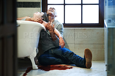 Buy stock photo Shot of a distraught man embracing a woman with a slit wrist in a bathtub