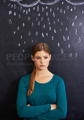 Buy stock photo Rain, sad and woman with cloud on chalkboard for depression, unhappy and upset mood. Storm, winter weather and person with crossed arms for attitude, emotion and worry expression on dark background