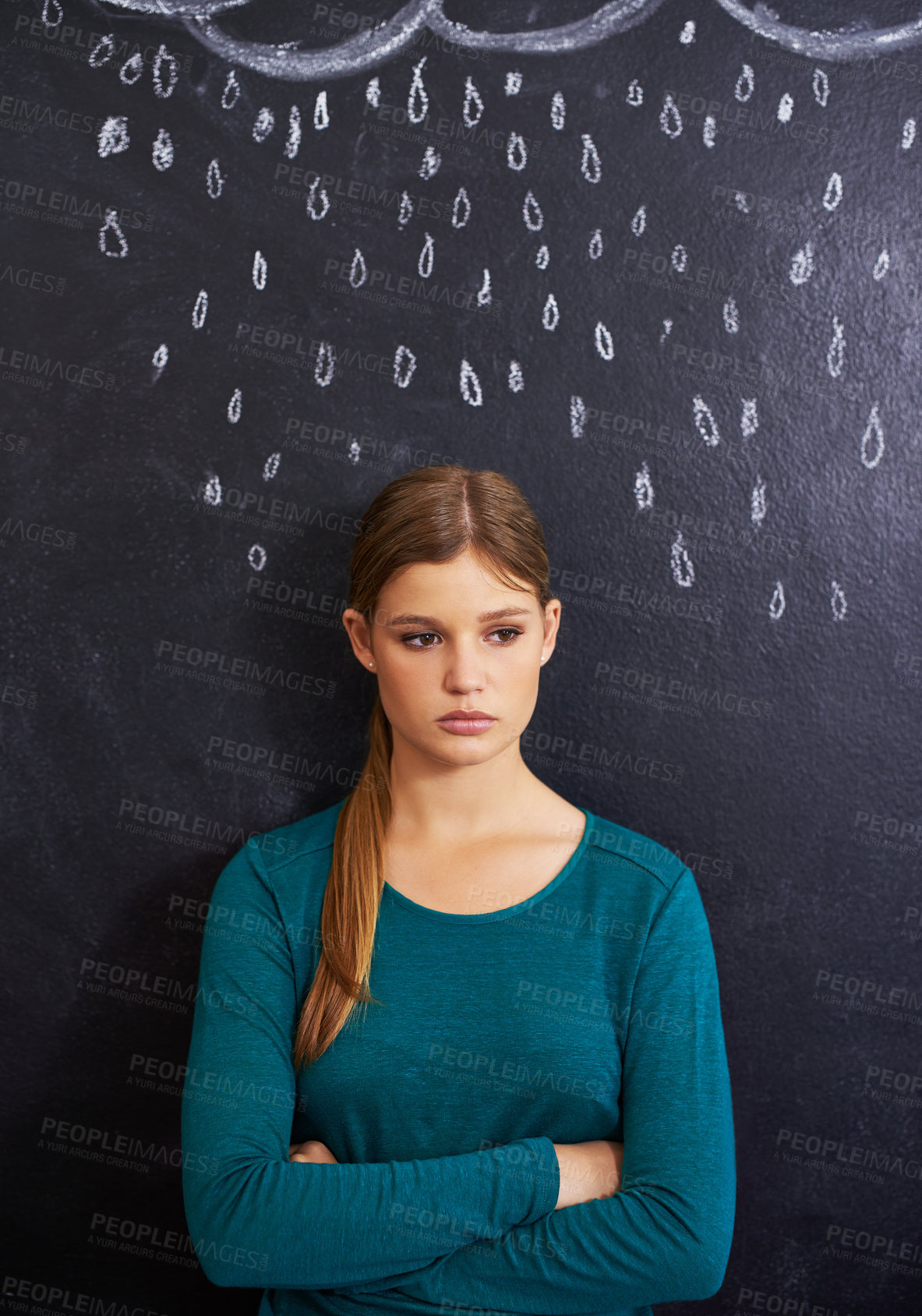 Buy stock photo Rain, sad and woman with cloud on chalkboard for depression, unhappy and upset mood. Storm, winter weather and person with crossed arms for attitude, emotion and worry expression on dark background