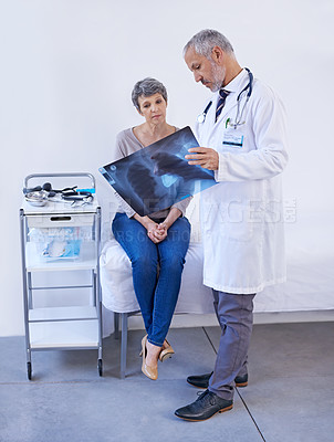 Buy stock photo Hospital, consulting and doctor with x ray for patient for results, medical scan and treatment. Healthcare, clinic and senior person in consultation for wellness service, examination and diagnosis