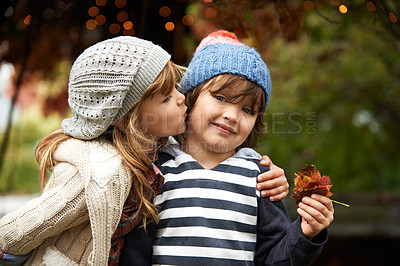 Buy stock photo Kids, love and siblings kiss in a park for travel, adventure or bonding on autumn journey in nature. Family, support and children hug in a forest for explore, playing or fun games in Canada outdoor