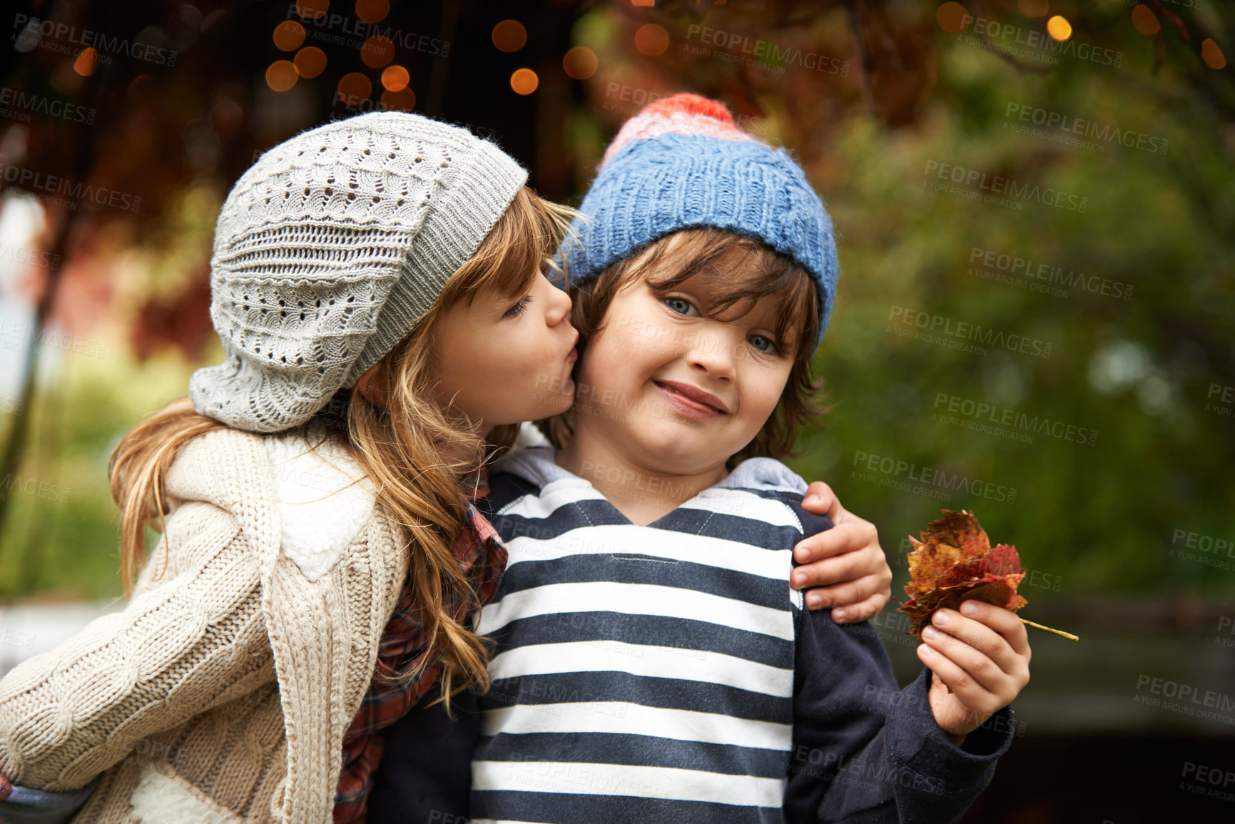 Buy stock photo Kids, love and siblings kiss in a park for travel, adventure or bonding on autumn journey in nature. Family, support and children hug in a forest for explore, playing or fun games in Canada outdoor