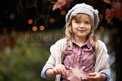Buy stock photo Happy, autumn and portrait of child in park with smile for weekend, face and adventure outdoors. Childhood, happiness and young girl with plants in nature for playing, relaxing and fun in garden