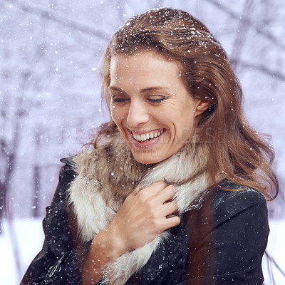Buy stock photo Shot of an attractive woman smiling in the snow