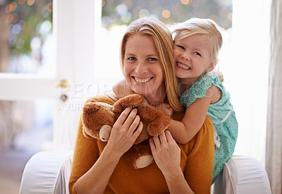 Buy stock photo Happy mom, portrait and hug with child or teddy bear for love, care or support together in living room at home. Face of mama, kid or daughter with smile for embrace, affection or mothers day at house