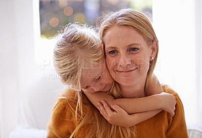 Buy stock photo Cropped shot of a little girl hugging her mother from behind