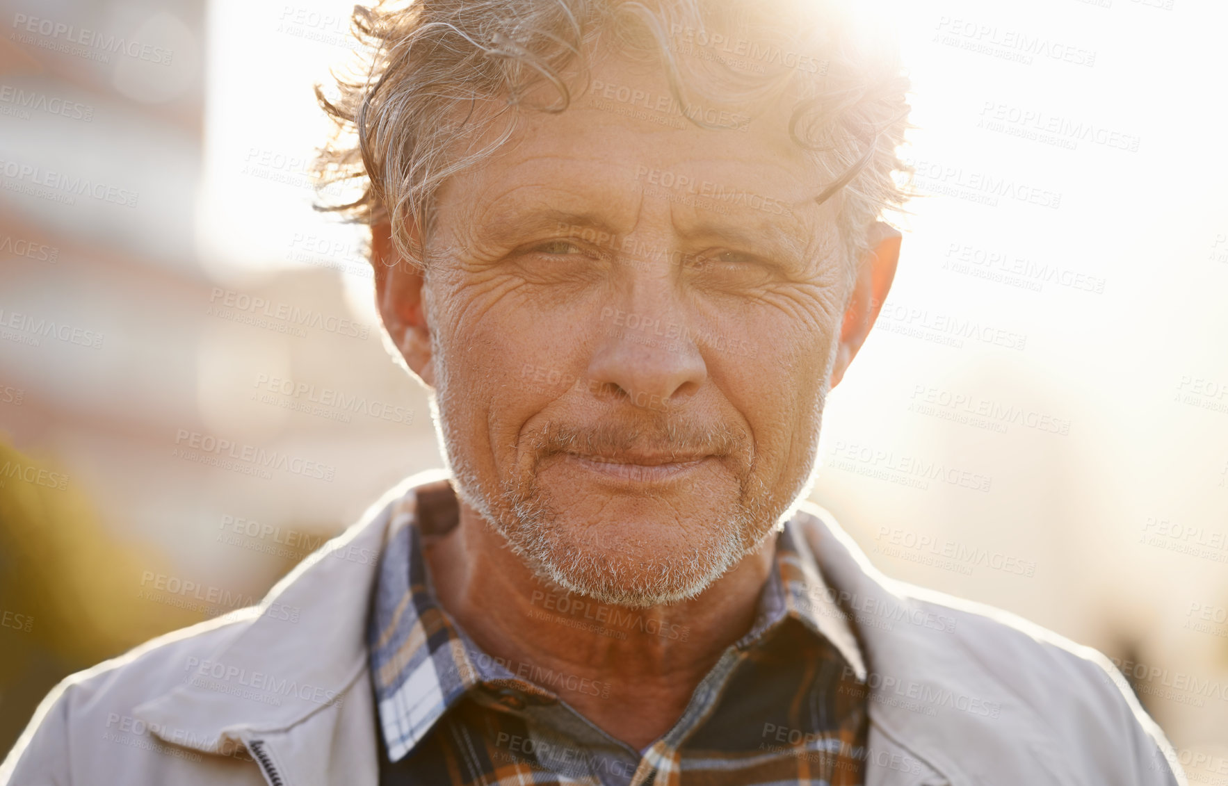 Buy stock photo Portrait, sunset and a senior man in the city during the day for travel or tourism during retirement. Face, wrinkles and lifestyle with a handsome male person standing outdoor in an urban town flare