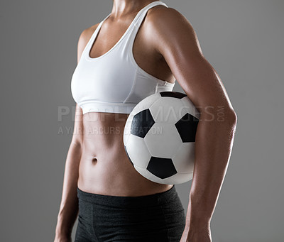 Buy stock photo Woman, closeup and soccer player with ball for match, game or fitness on a gray studio background. Body of female person or athlete with football for sports exercise, workout or training on mockup