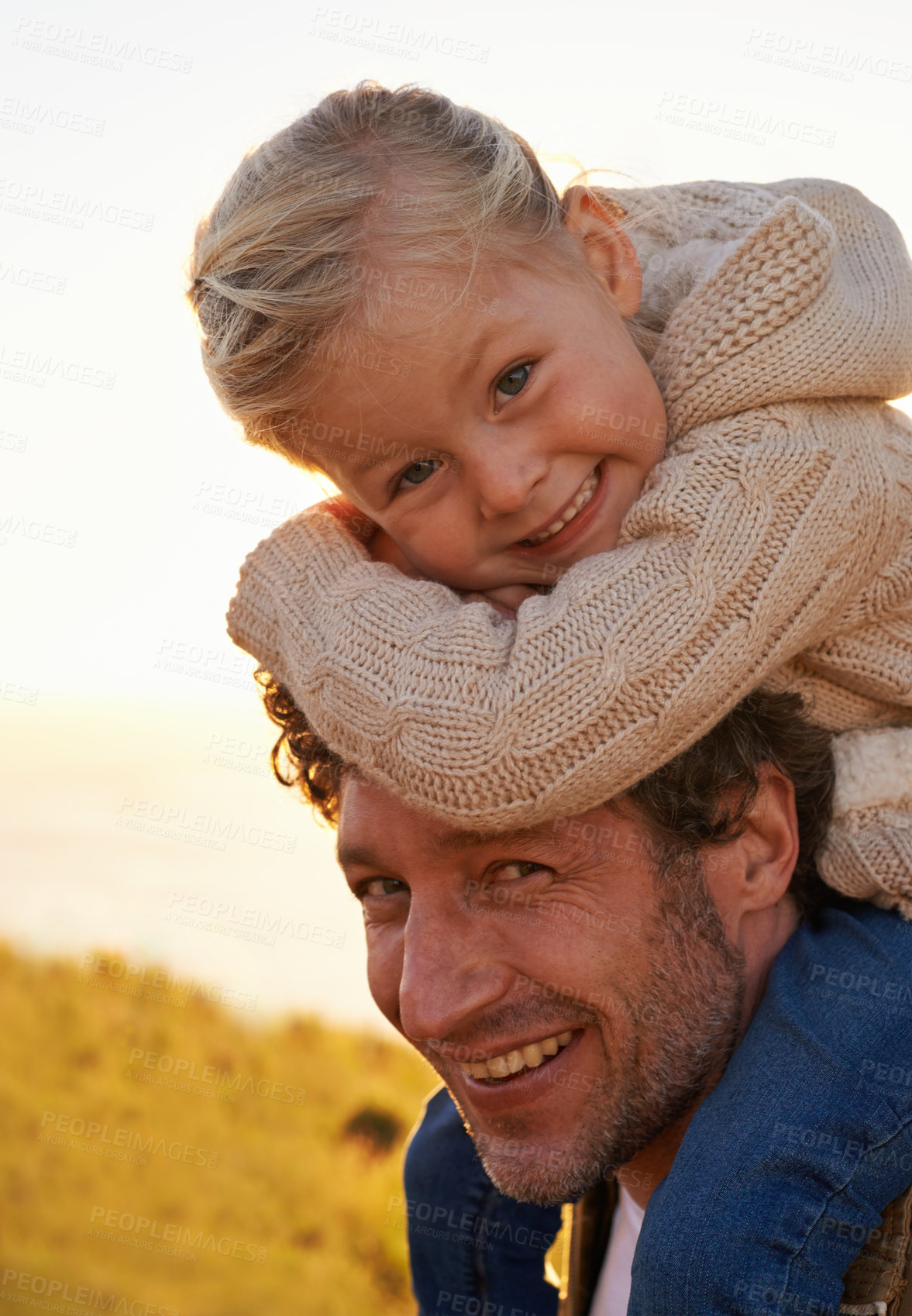 Buy stock photo Nature, sunset and portrait of father and child on holiday, vacation and adventure outdoors. Happy family, summer and child on shoulders of dad for bonding, relationship and fun together on weekend