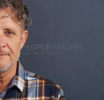 Buy stock photo Half, face and mature man in studio on dark background with model or senior mockup. Confident, person and dermatology portrait with pride or guy relax in space with plaid pattern in fashion