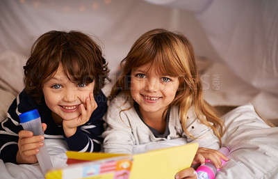 Buy stock photo Book, blanket fort and portrait of children reading for knowledge, learning and education with flashlight. Bonding, relaxing and happy young kids enjoying story or novel together in tent at home.