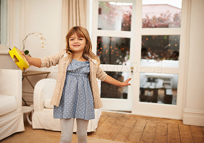 Buy stock photo Little, girl and dance with portrait in living room for fun, entertainment and game with musical instrument. Kid, home and tambourine for sound or music to move, freedom and childhood with happiness.