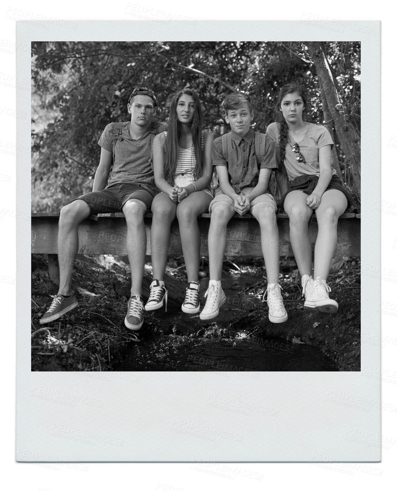 Buy stock photo Teen, friends and sit in forest for hike on outdoor to relax with camping and break in California. Polaroid, woods and together in summer for holiday with bonding, fun and adventure in vacation.