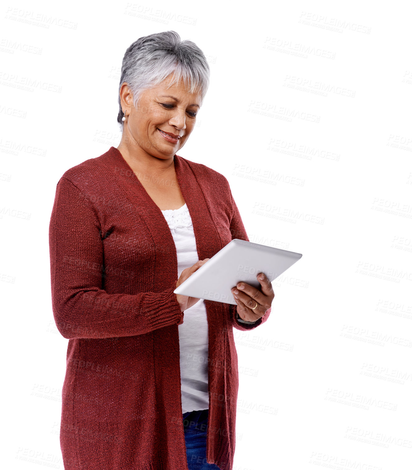 Buy stock photo Studio shot of a mature woman using a digital tablet isolated on white